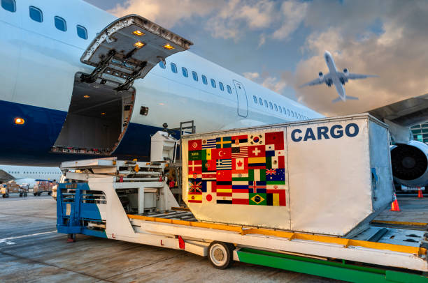 Loading the container with a Many countrie flags in the cargo airplane. Loading the container with a Many countrie flags in the cargo airplane.